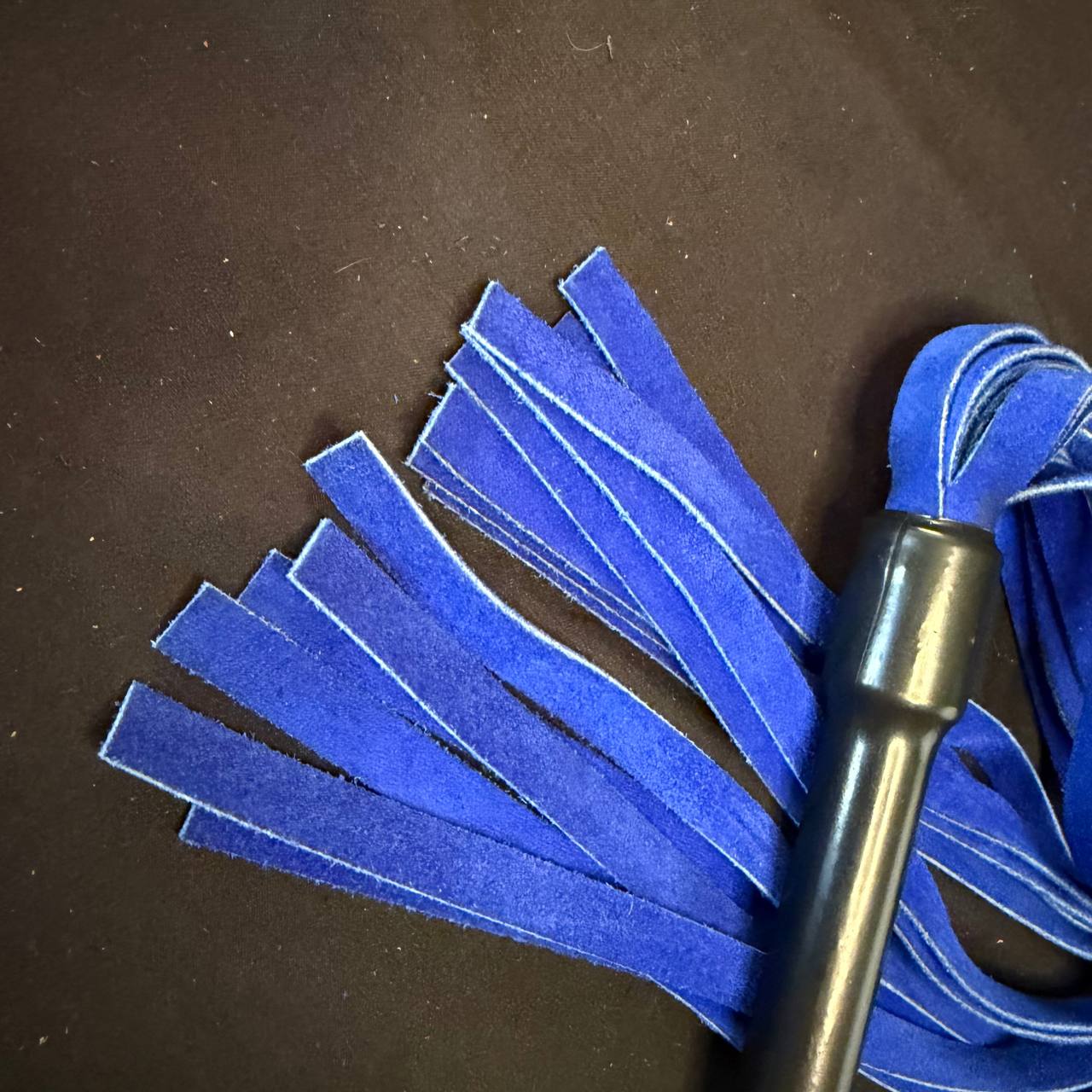 Royal blue suede flogger with black metal handle
