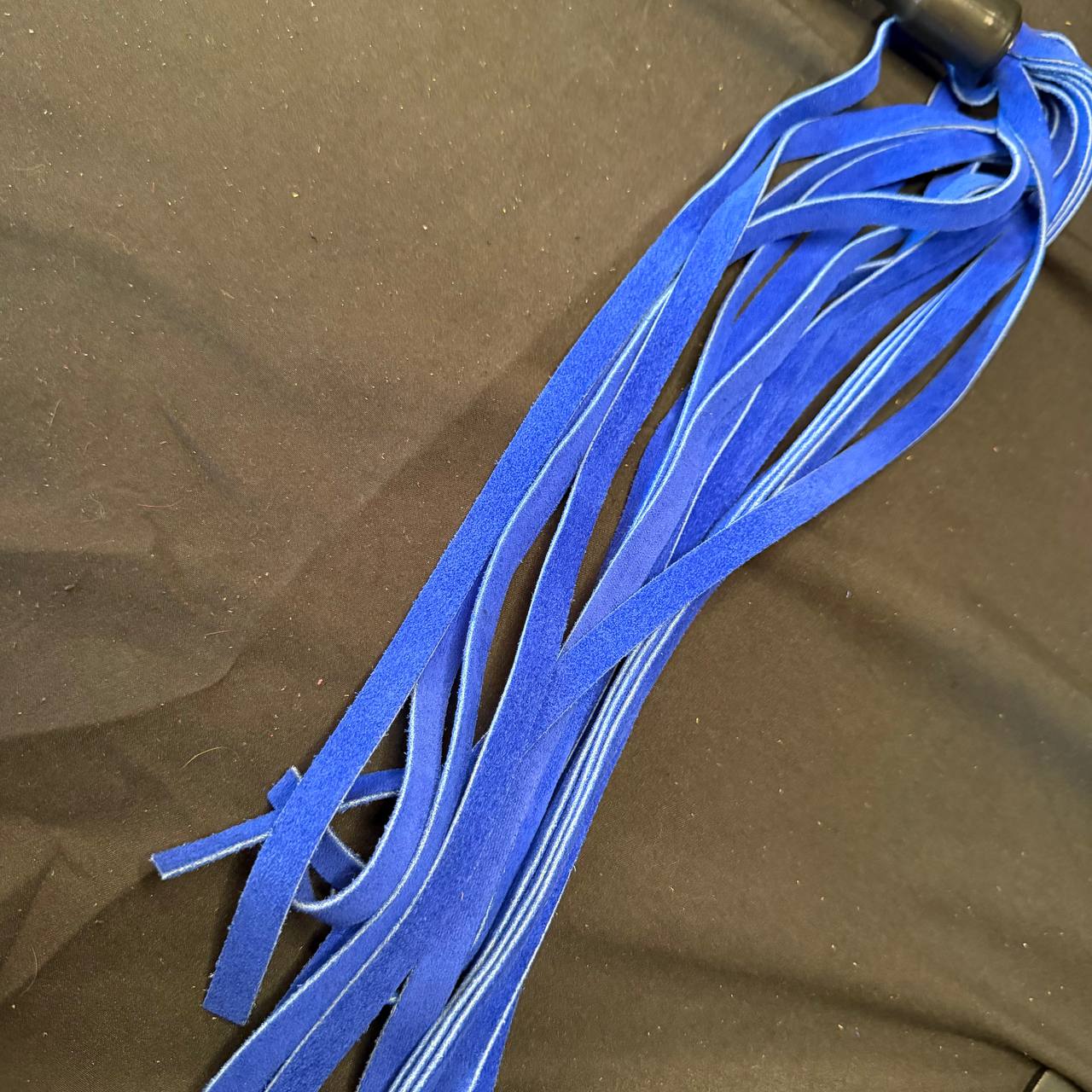Royal blue suede flogger with black metal handle