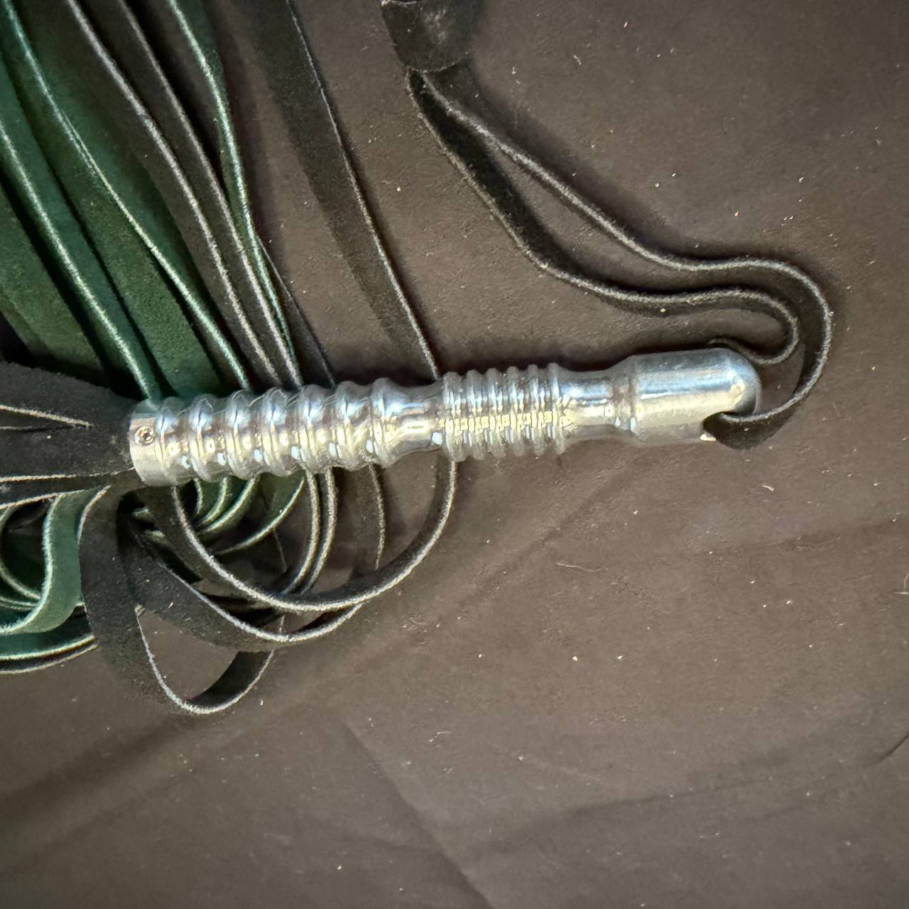 Green and black suede flogger with aluminum handle - 15 inch falls 5 inch handle