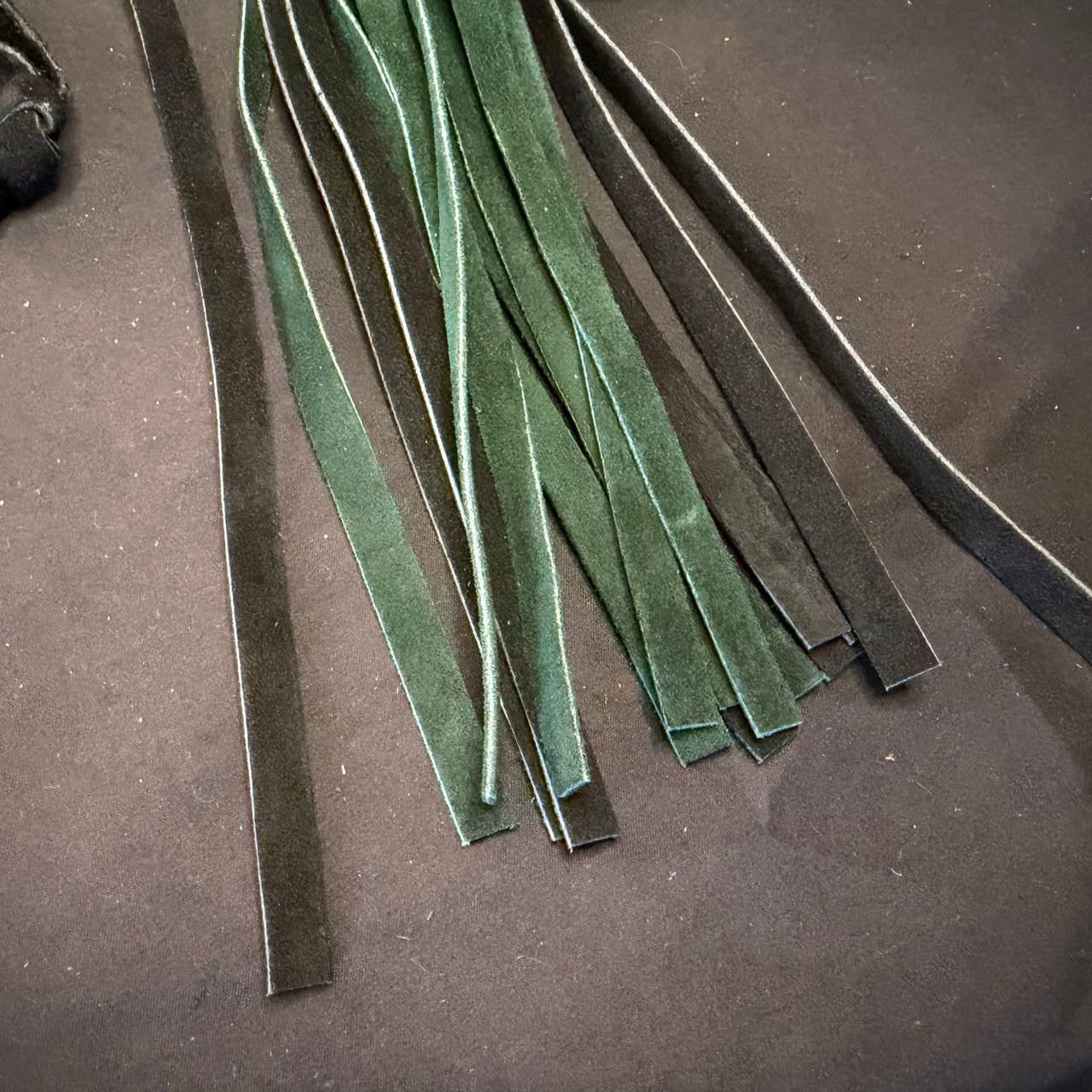 Green and black suede flogger aluminum handle